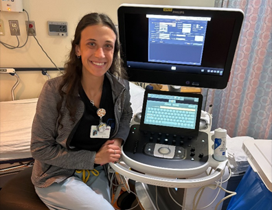 Dana sitting next to hospital equipment